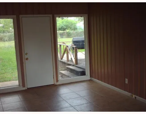 a view of a glass door and the balcony