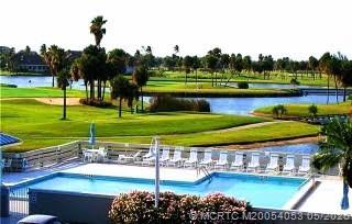10 Northeast Plantation Road, Unit 101 Jensen Beach, FL 34957 - Photo 50 of 53 a view of a park with large trees