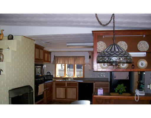 21 Clara Road Framingham, MA 01701 - Photo 7 of 7 a kitchen with a refrigerator and stove