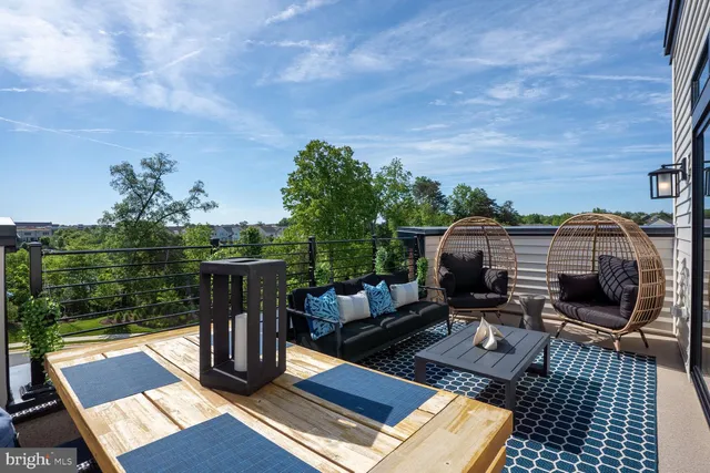 a view of a terrace with wooden floor and outdoor seating