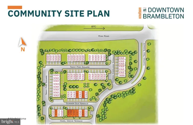 a sign that is sitting in the middle of a garden