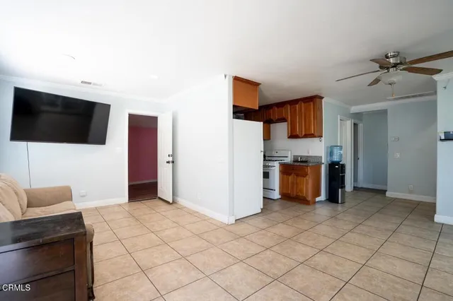 a kitchen with stainless steel appliances a refrigerator and a stove top oven