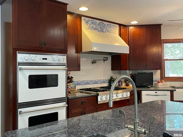 a view of a living room and entryway