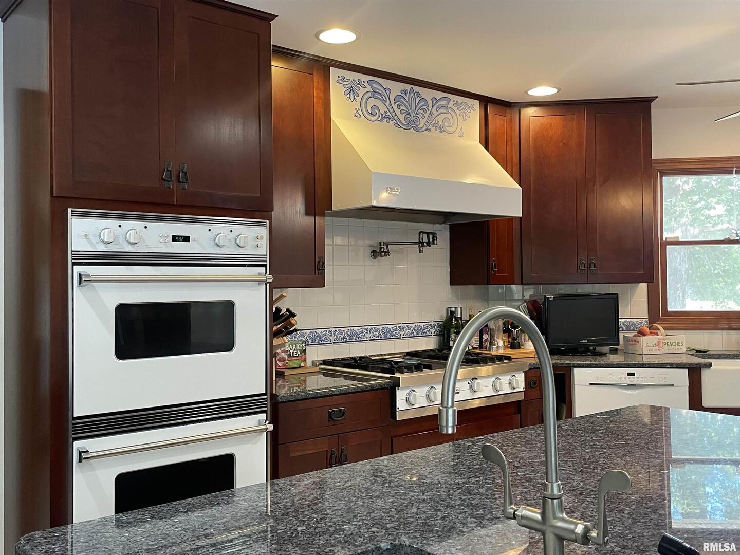 2479 New Era Road Murphysboro, IL 62966 - Photo 16 of 86 a kitchen with a stove and a sink