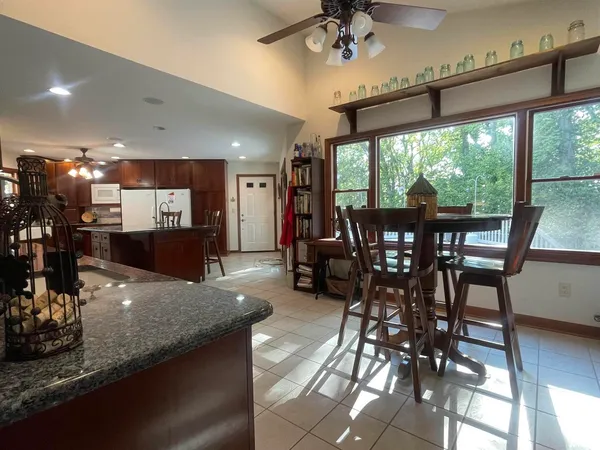 a view of a dining room with furniture window and outside view