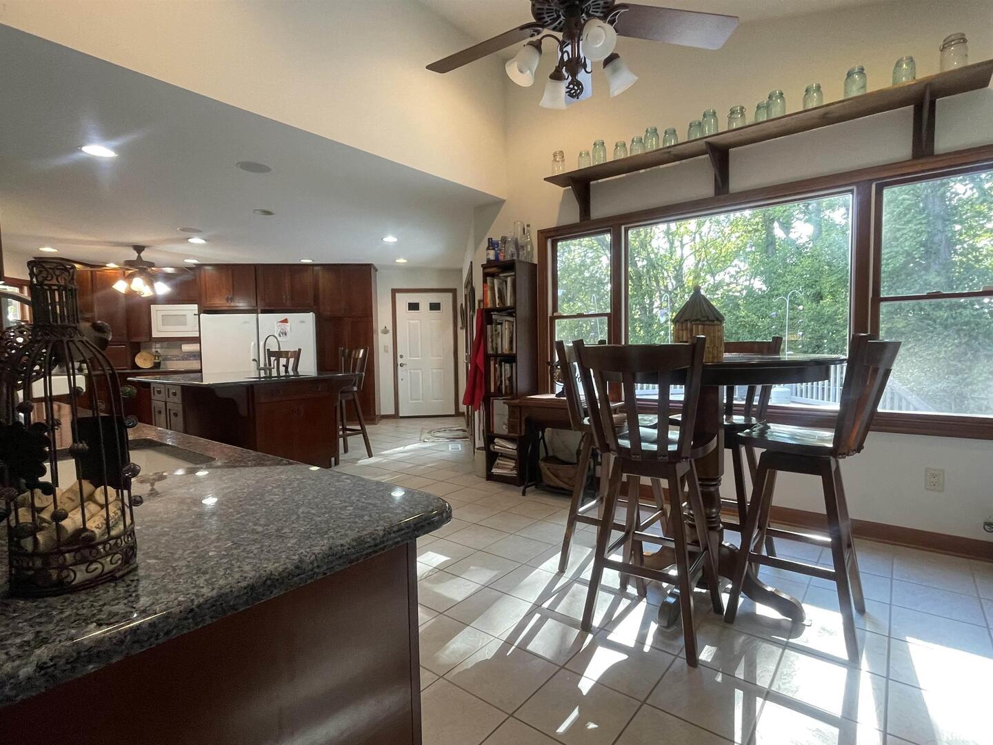 2479 New Era Road Murphysboro, IL 62966 - Photo 19 of 86 a view of a dining room with furniture window and outside view