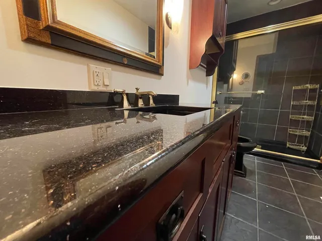 a kitchen with stainless steel appliances a stove a sink and a refrigerator