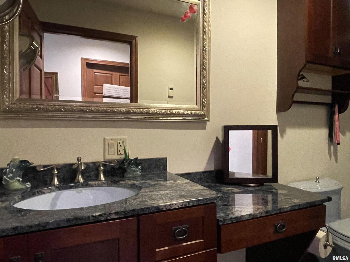 2479 New Era Road Murphysboro, IL 62966 - Photo 37 of 86 a bathroom with a granite countertop sink and a mirror