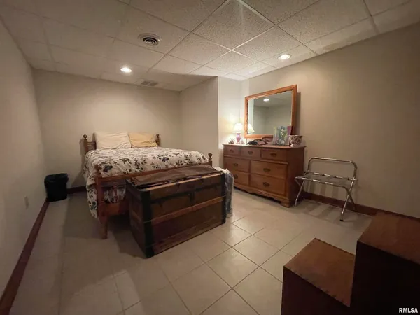 a backyard of a house with a garden and plants