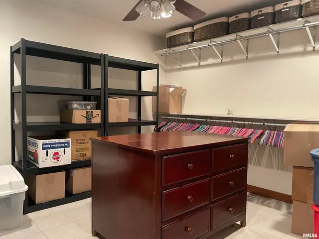 a view of a chairs and table in the back yard of the house