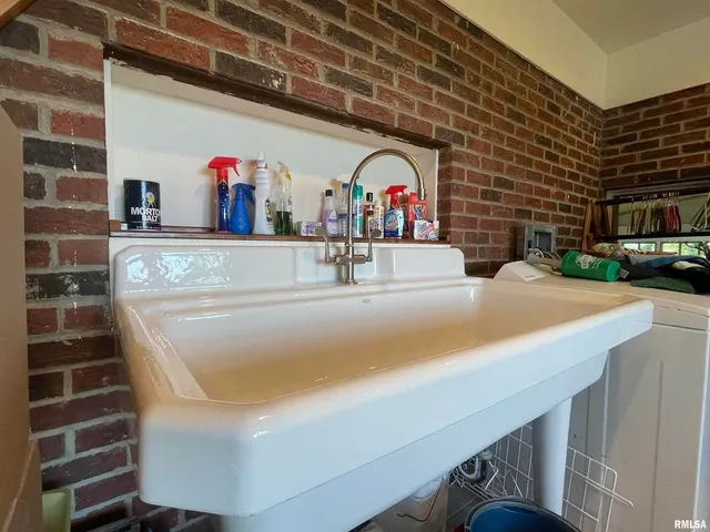 a room with pool table and window