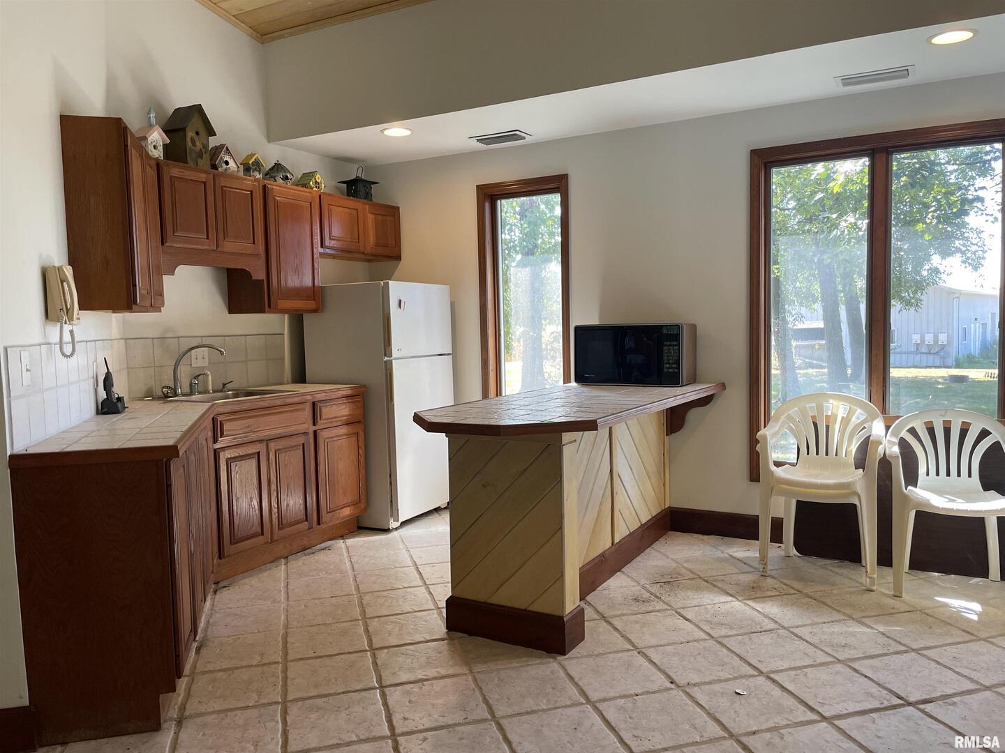 2479 New Era Road Murphysboro, IL 62966 - Photo 54 of 86 a kitchen with stainless steel appliances a stove a sink and a refrigerator