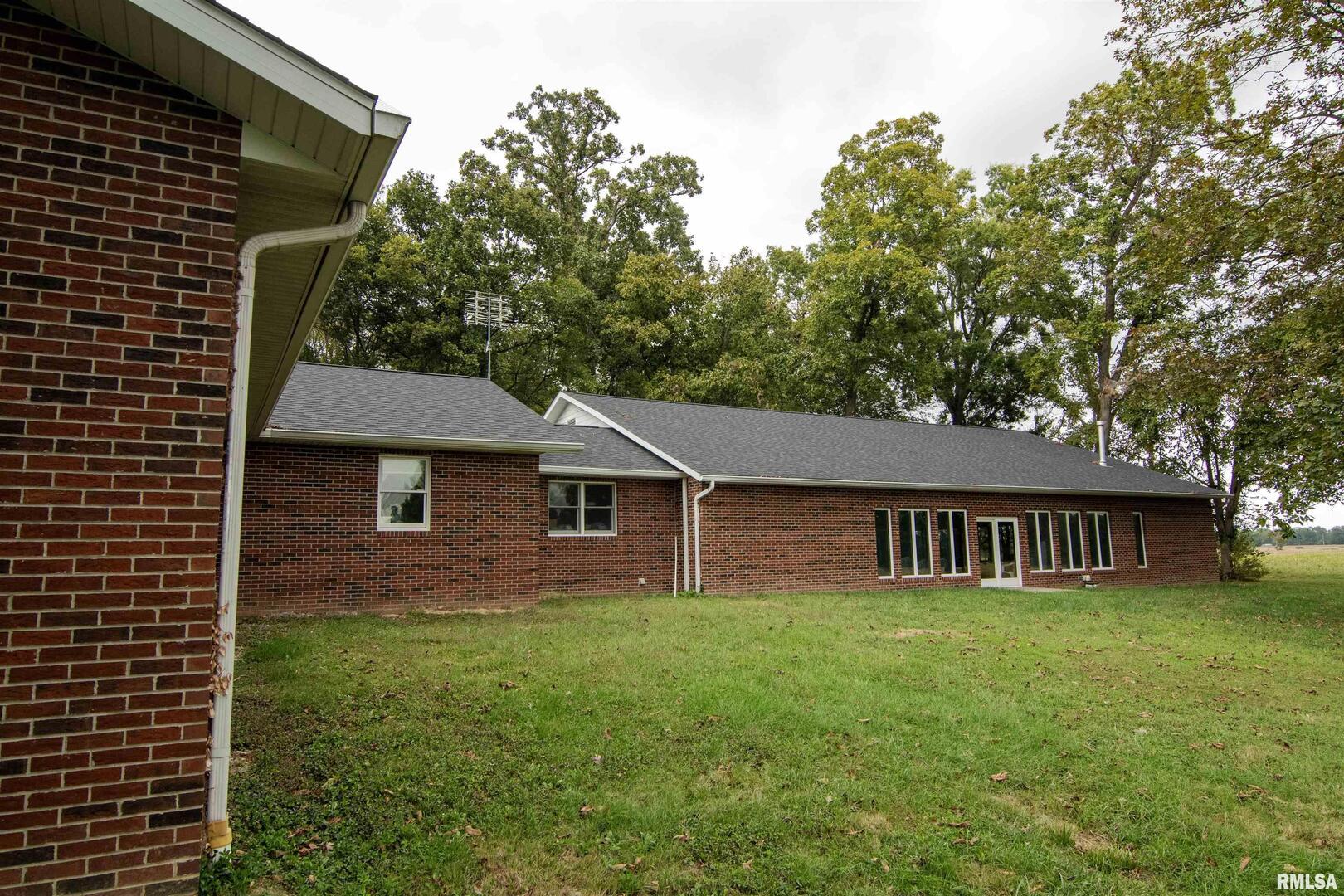 2479 New Era Road Murphysboro, IL 62966 - Photo 7 of 86 a view of a house with a yard