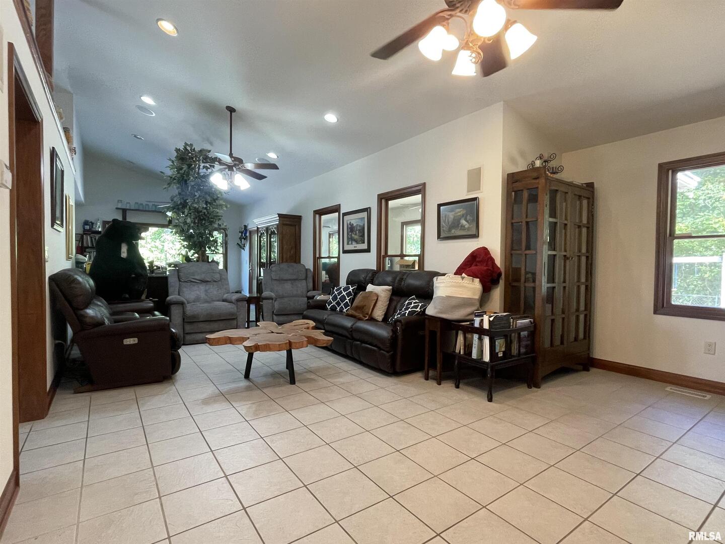 2479 New Era Road Murphysboro, IL 62966 - Photo 10 of 86 a living room with furniture a chandelier and a flat screen tv