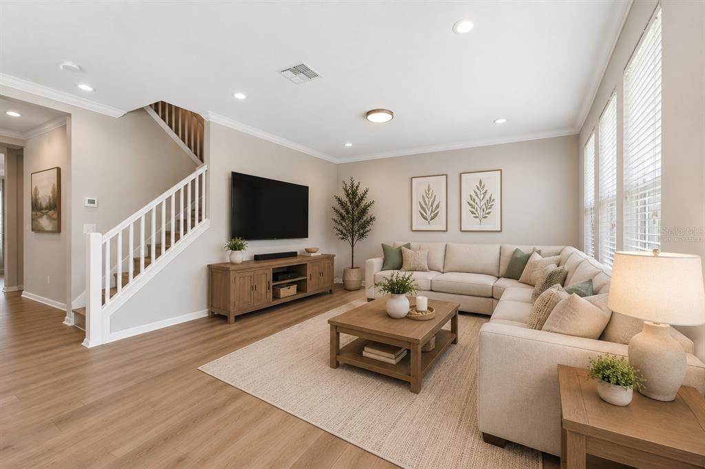 1192 Multiflora Loop Lutz, FL 33558 - Photo 14 of 32 a living room with furniture and a flat screen tv