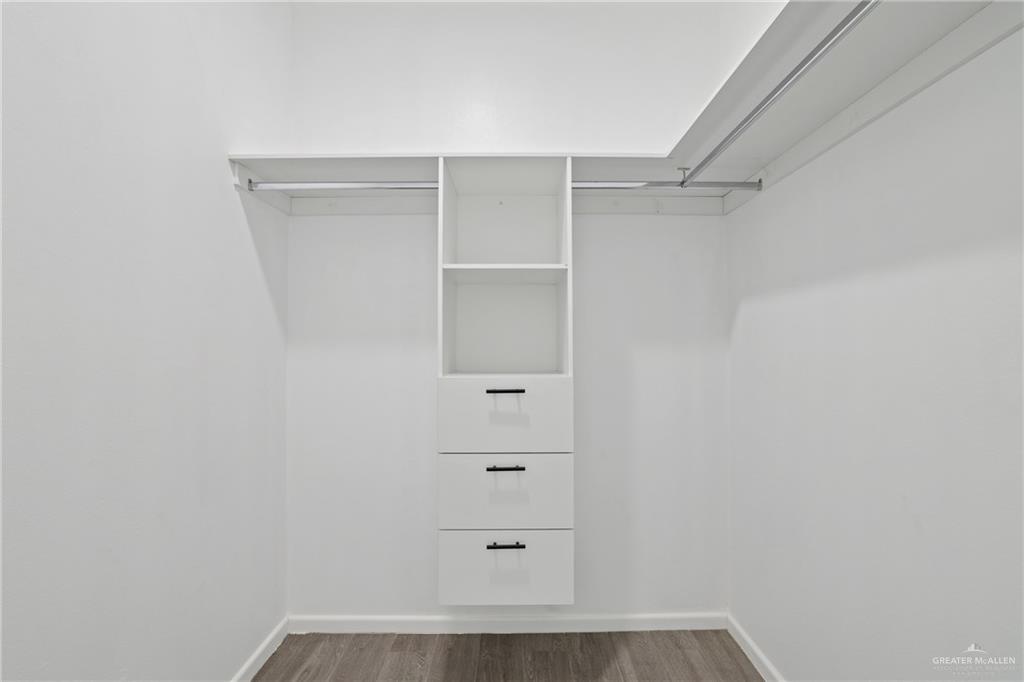 3208 Briggs Street, Unit 3 Weslaco, TX 78596 - Photo 5 of 10 Walk in closet with wood finished floors