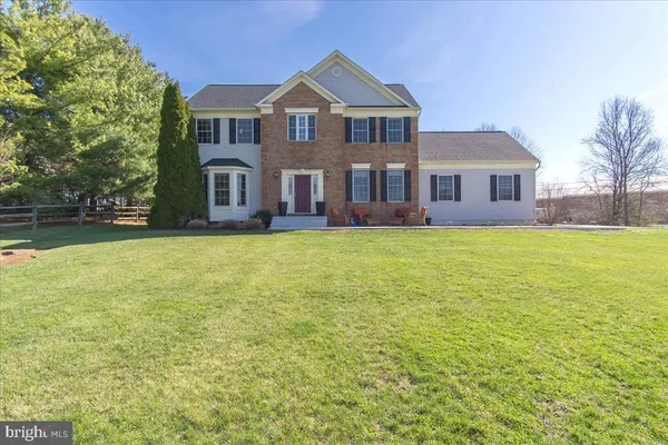 a view of a swimming pool with a table and chairs