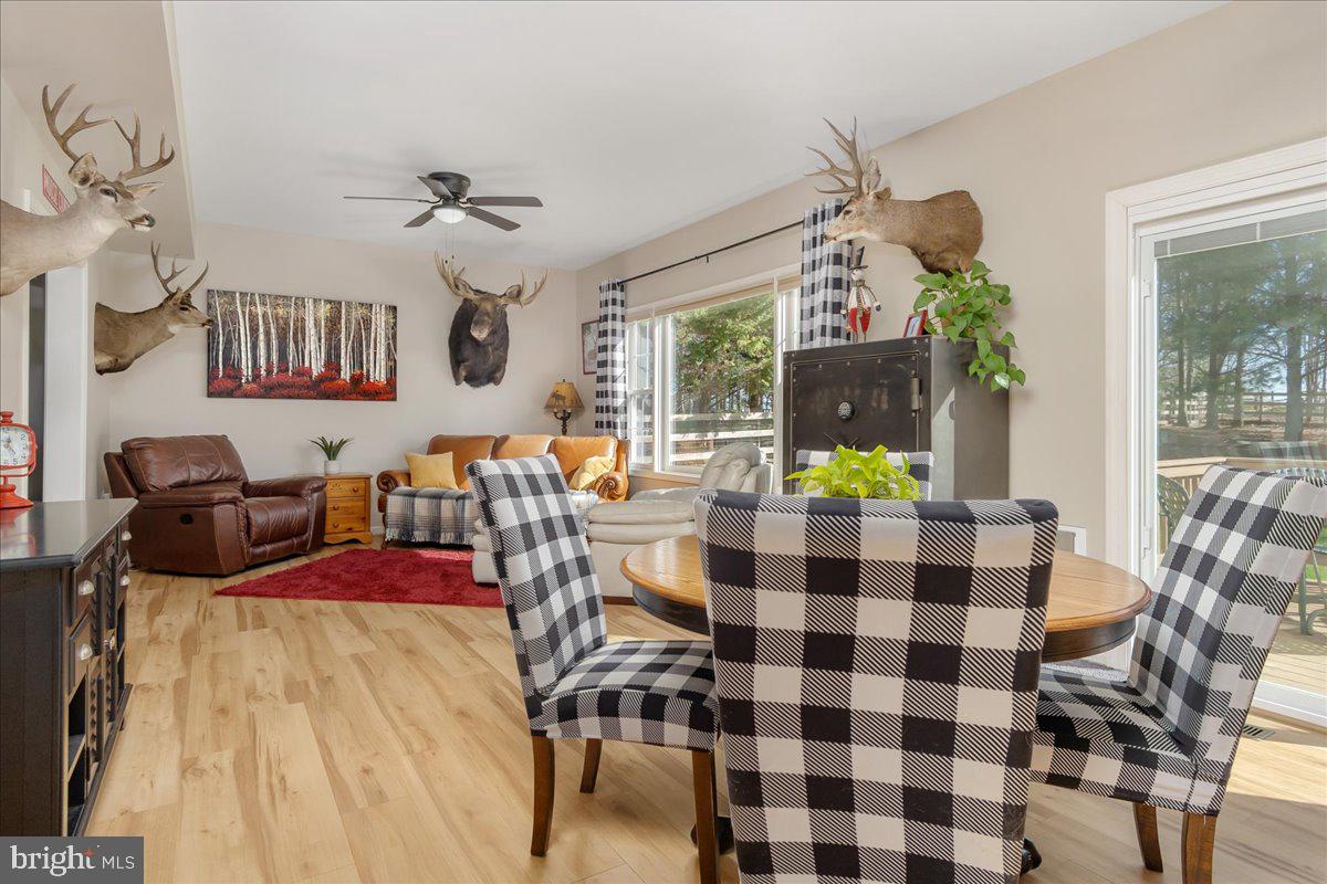 20376 Splendor View Terrace Hagerstown, MD 21740 - Photo 14 of 52 a view of a dining room with furniture a chandelier and wooden floor