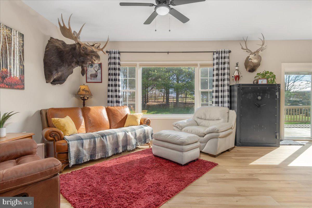 20376 Splendor View Terrace Hagerstown, MD 21740 - Photo 16 of 52 a living room with furniture and a floor to ceiling window