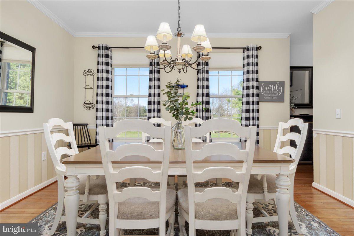 20376 Splendor View Terrace Hagerstown, MD 21740 - Photo 20 of 52 a view of a dining room with furniture and wooden floor