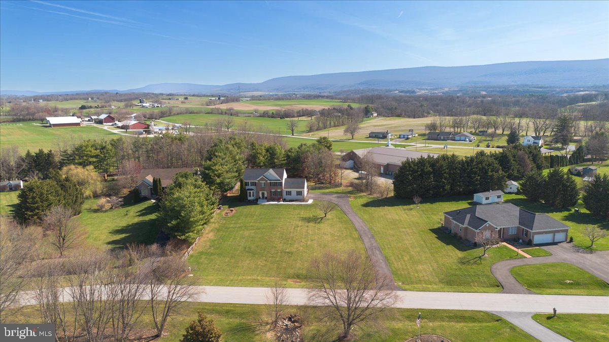 20376 Splendor View Terrace Hagerstown, MD 21740 - Photo 2 of 52 a view of a swimming pool with a table and chairs