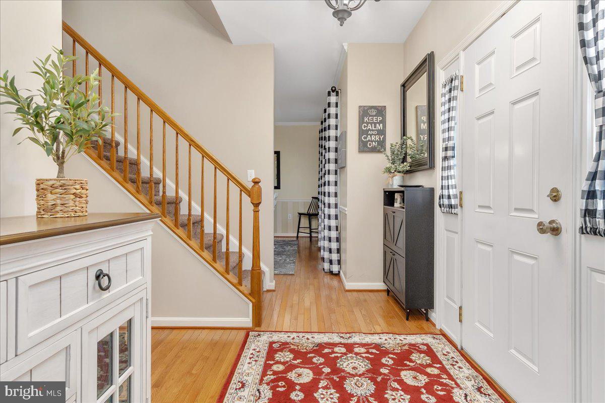 20376 Splendor View Terrace Hagerstown, MD 21740 - Photo 6 of 52 a view of hallway with wooden floor and stairs
