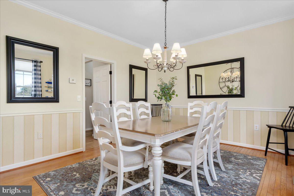 20376 Splendor View Terrace Hagerstown, MD 21740 - Photo 7 of 52 a view of a dining room with furniture and chandelier