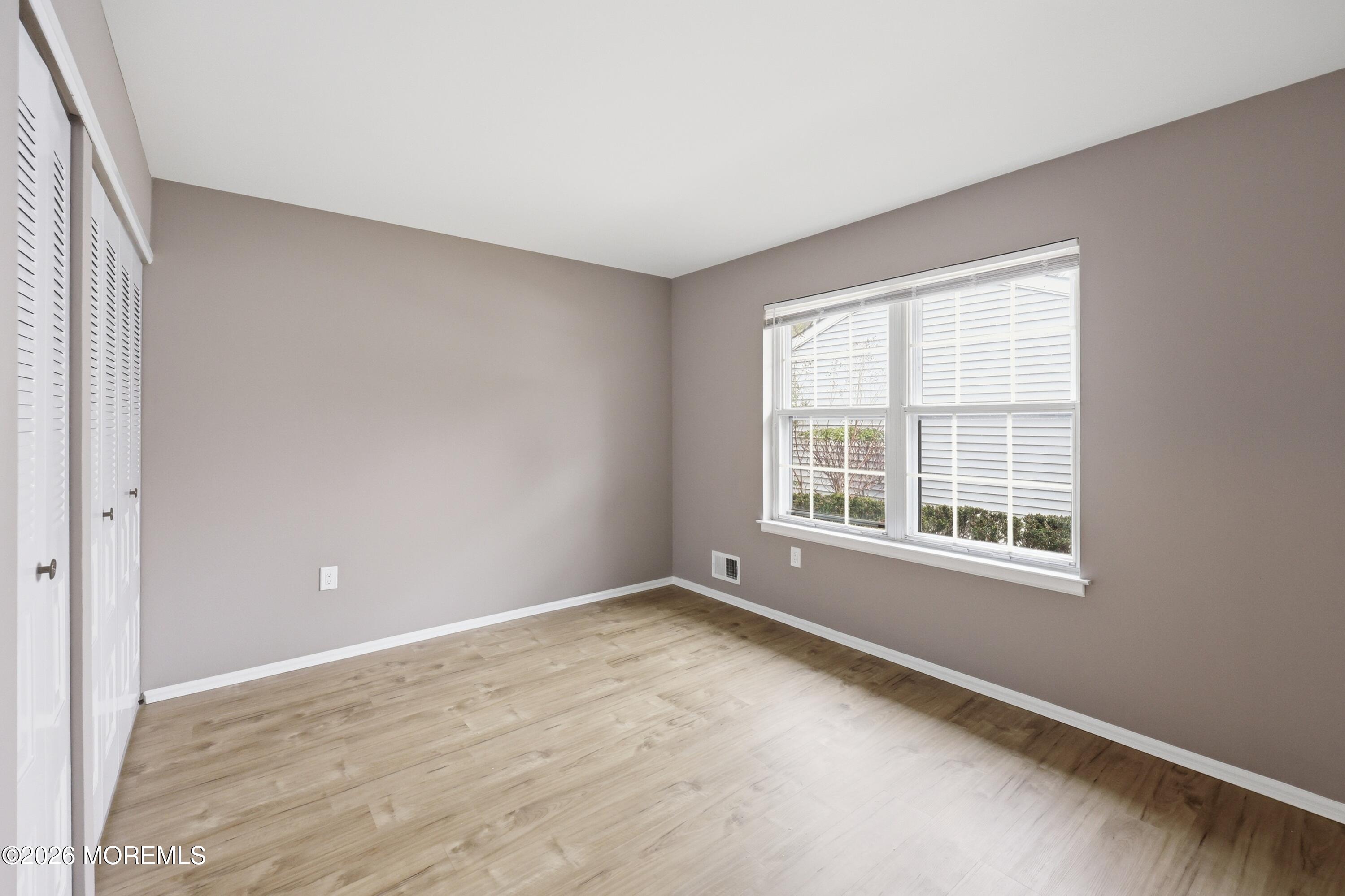 64 Boxwood Terrace Red Bank, NJ 07701 - Photo 12 of 32 a view of an empty room with a window