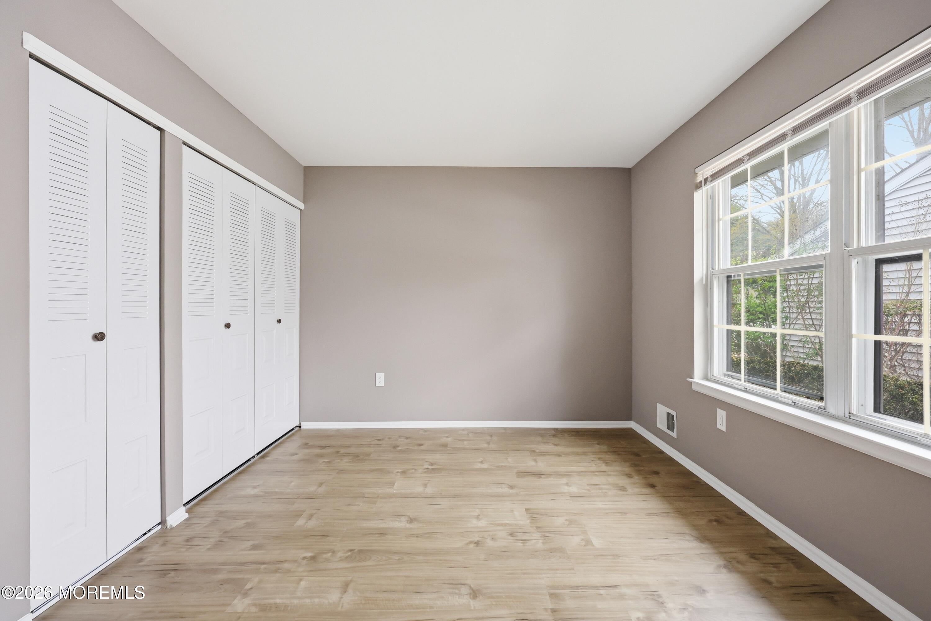 64 Boxwood Terrace Red Bank, NJ 07701 - Photo 13 of 32 a view of an empty room with a window