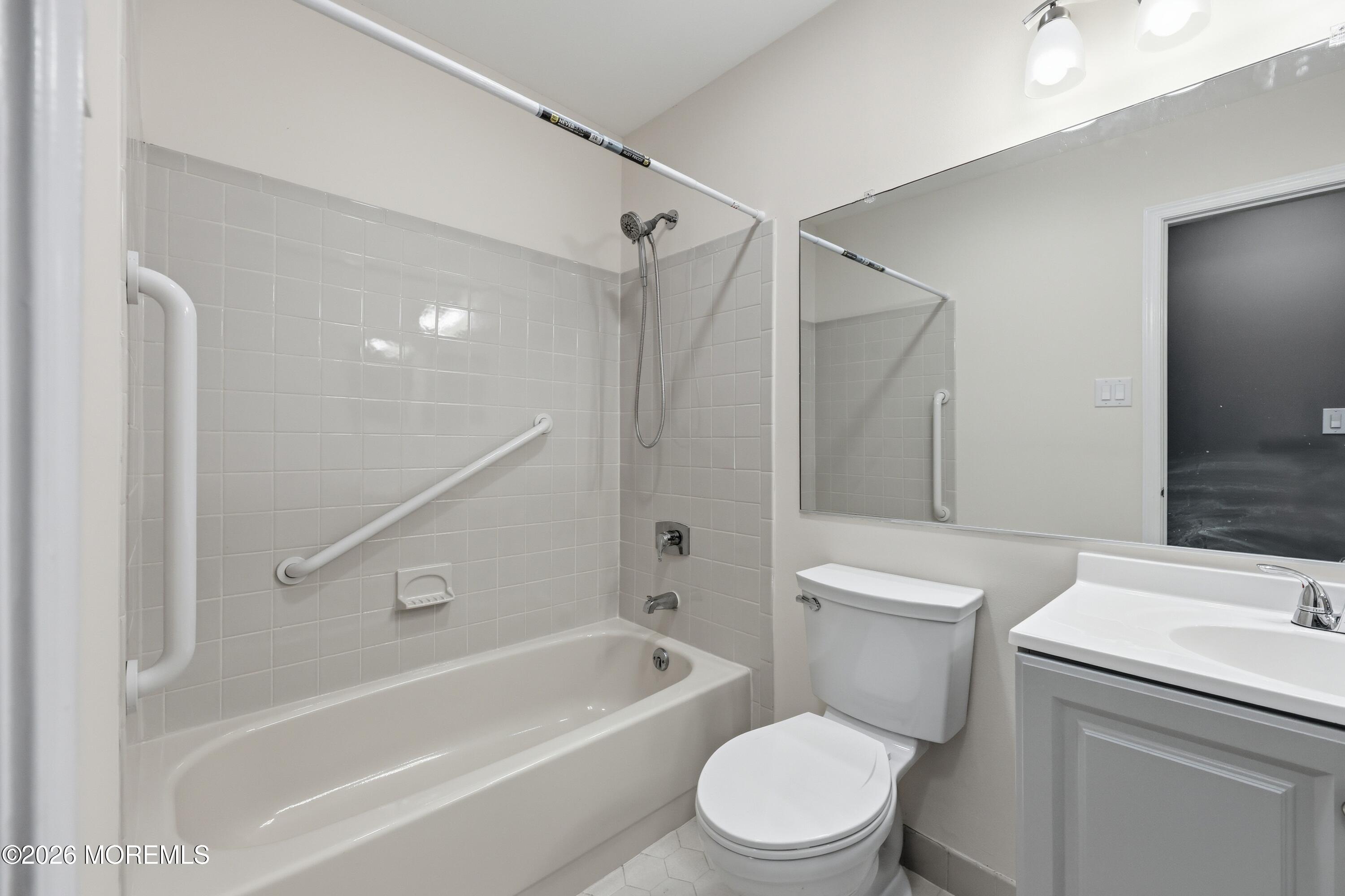 64 Boxwood Terrace Red Bank, NJ 07701 - Photo 14 of 32 a white toilet and tub sitting next to a bathroom sink
