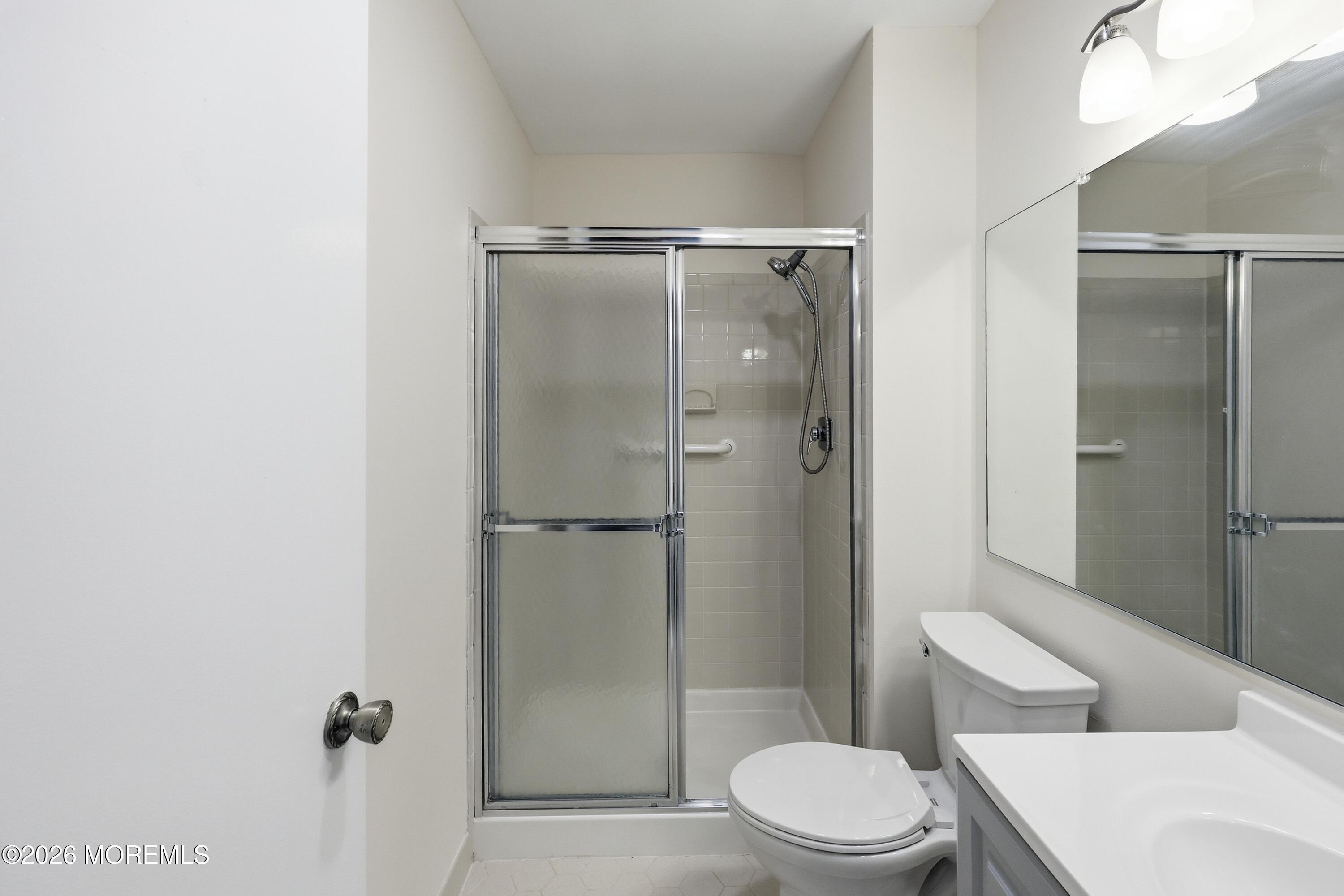 64 Boxwood Terrace Red Bank, NJ 07701 - Photo 16 of 32 a bathroom with a toilet and a shower