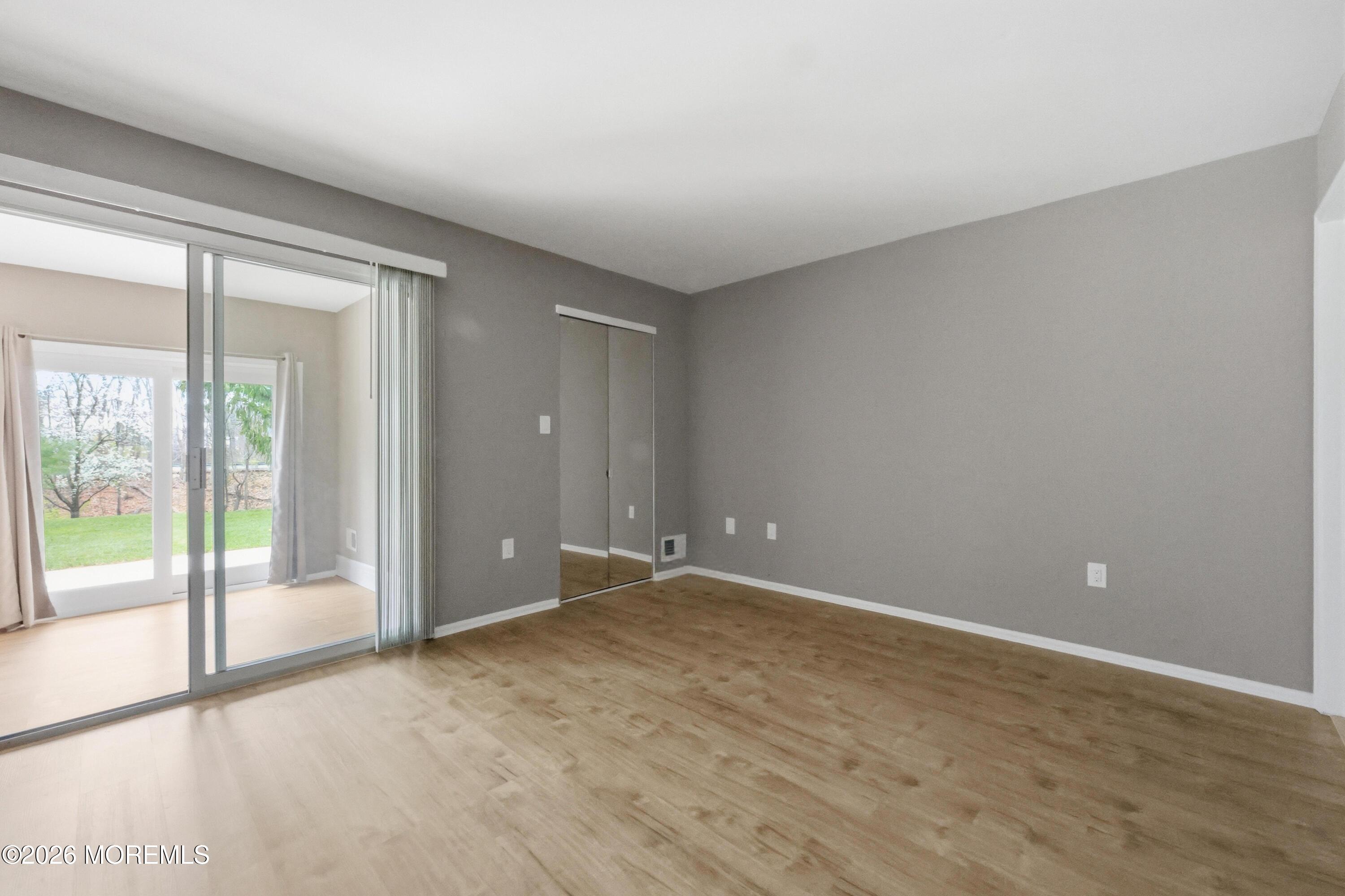 64 Boxwood Terrace Red Bank, NJ 07701 - Photo 19 of 32 a view of an empty room with glass door