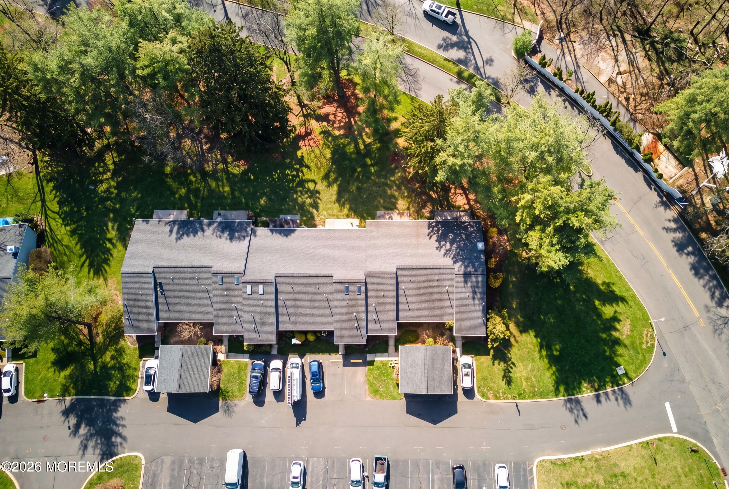 64 Boxwood Terrace Red Bank, NJ 07701 - Photo 27 of 32 an aerial view of a house with large trees