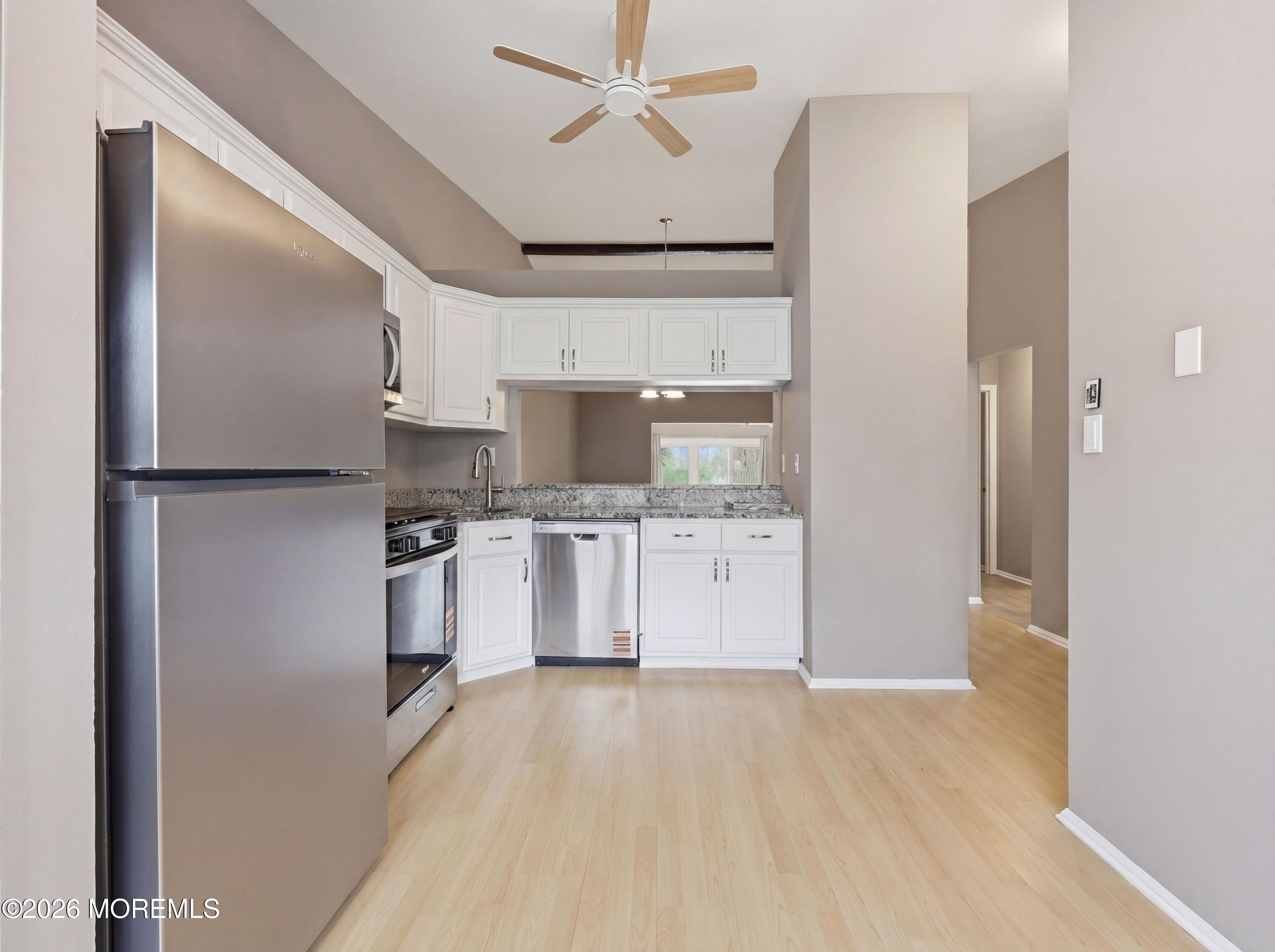 64 Boxwood Terrace Red Bank, NJ 07701 - Photo 5 of 32 a kitchen with stainless steel appliances a refrigerator and a stove top oven