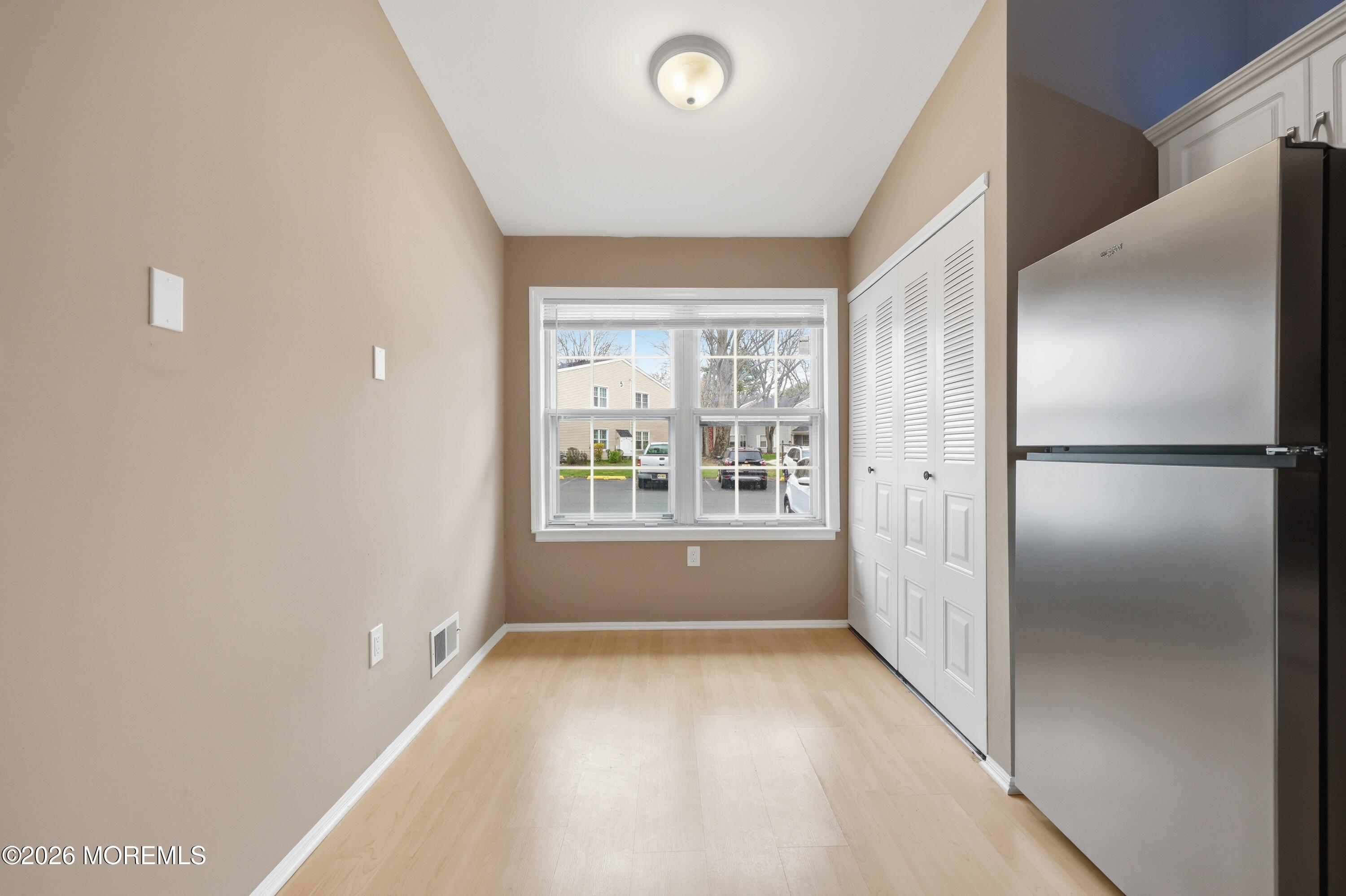 64 Boxwood Terrace Red Bank, NJ 07701 - Photo 6 of 32 a view of an empty room with a window