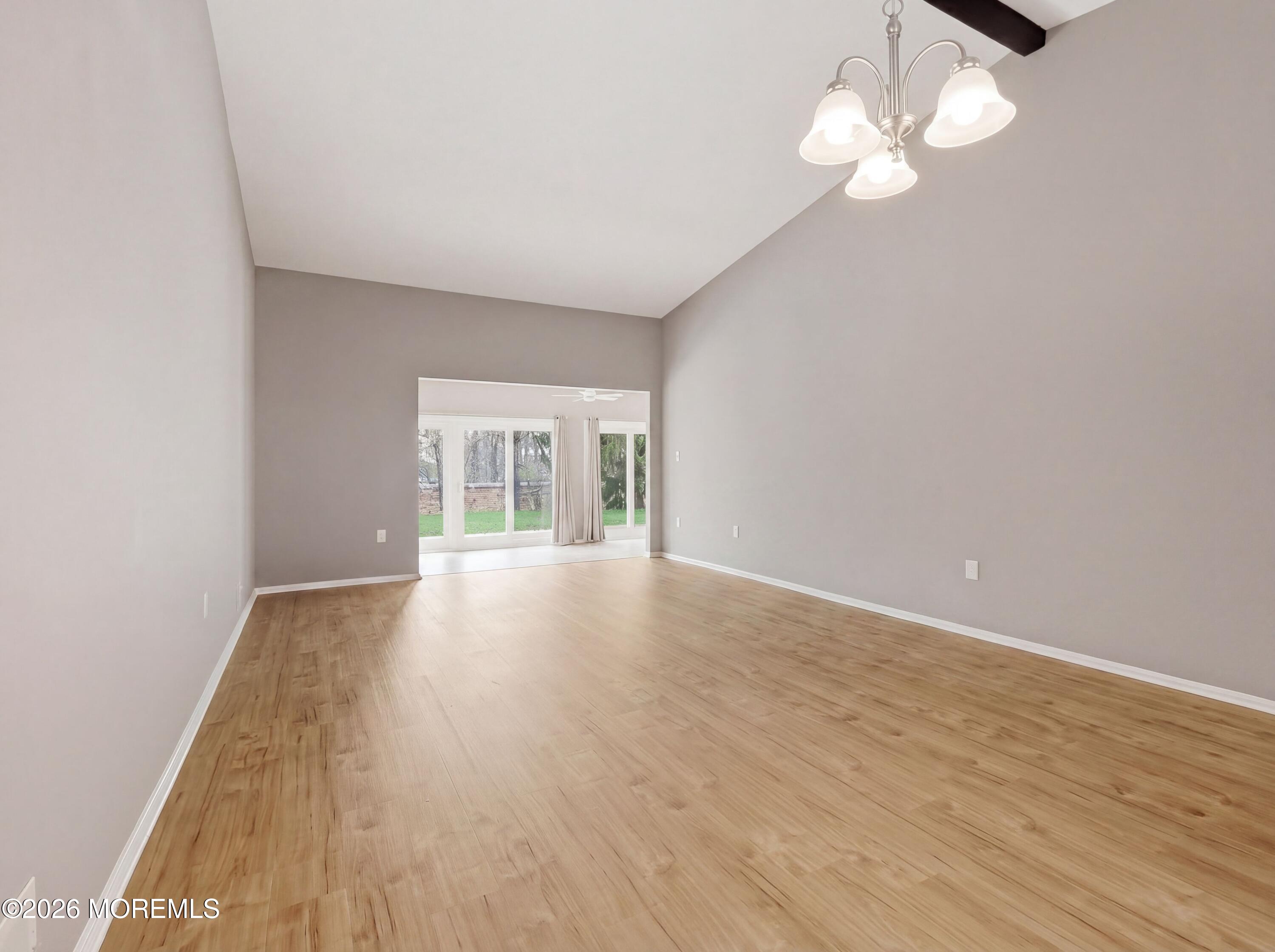 64 Boxwood Terrace Red Bank, NJ 07701 - Photo 8 of 32 wooden floor in an empty room with a window