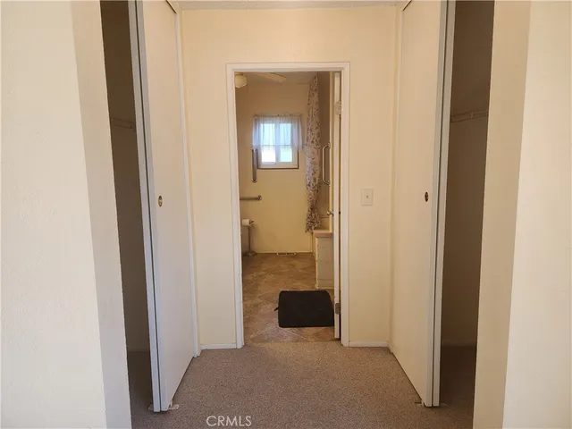 a view of a bathroom from a hallway