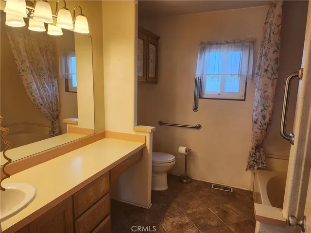 a bathroom with a sink and a toilet