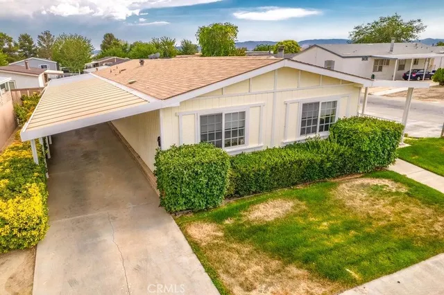 a aerial view of a house with a yard