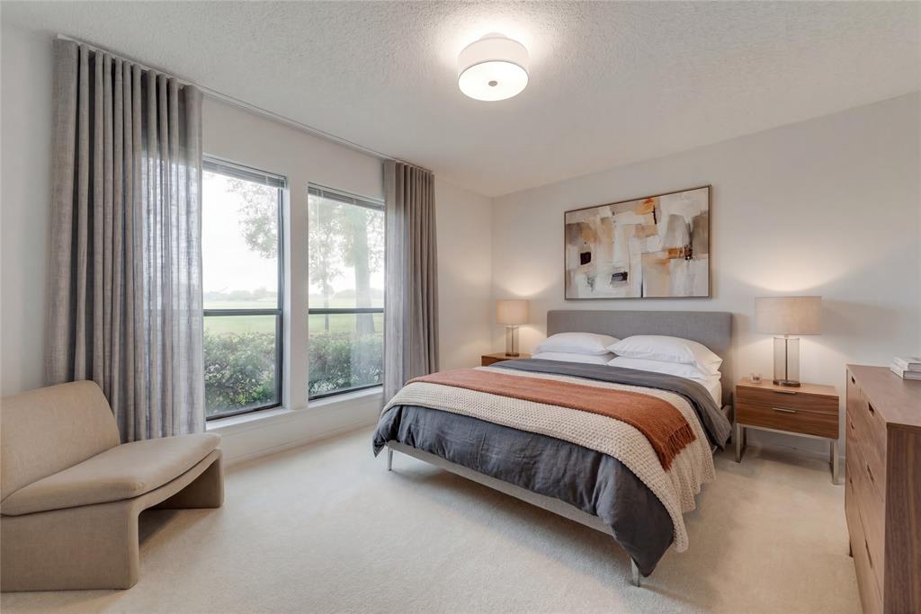 460 West J E Woody Road Springtown, TX 76082 - Photo 11 of 22 a bedroom with a bed and a large window