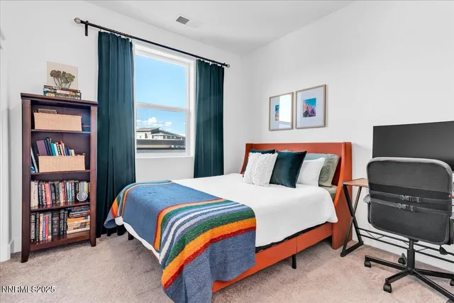 a bedroom with a bed and dresser