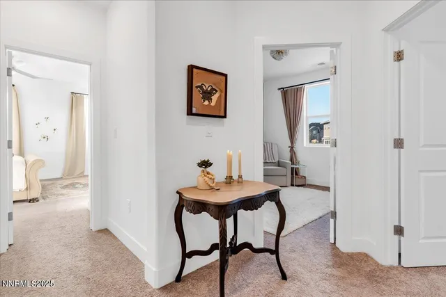 a view of a room with furniture and wooden floor