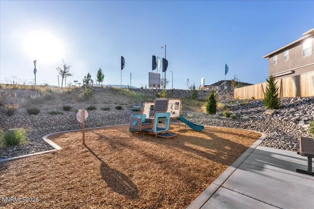 a view of a backyard with sitting area