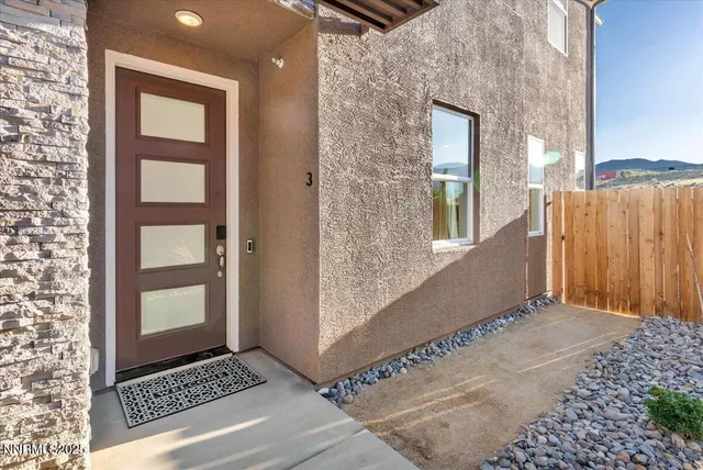 a view of a door and a window
