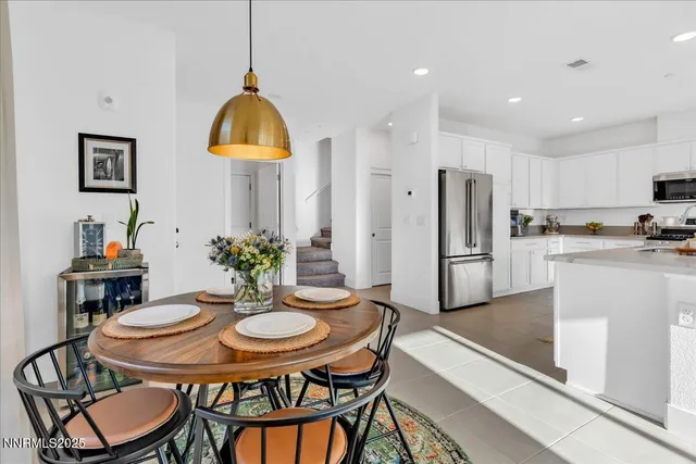 a kitchen with a table and chairs in it