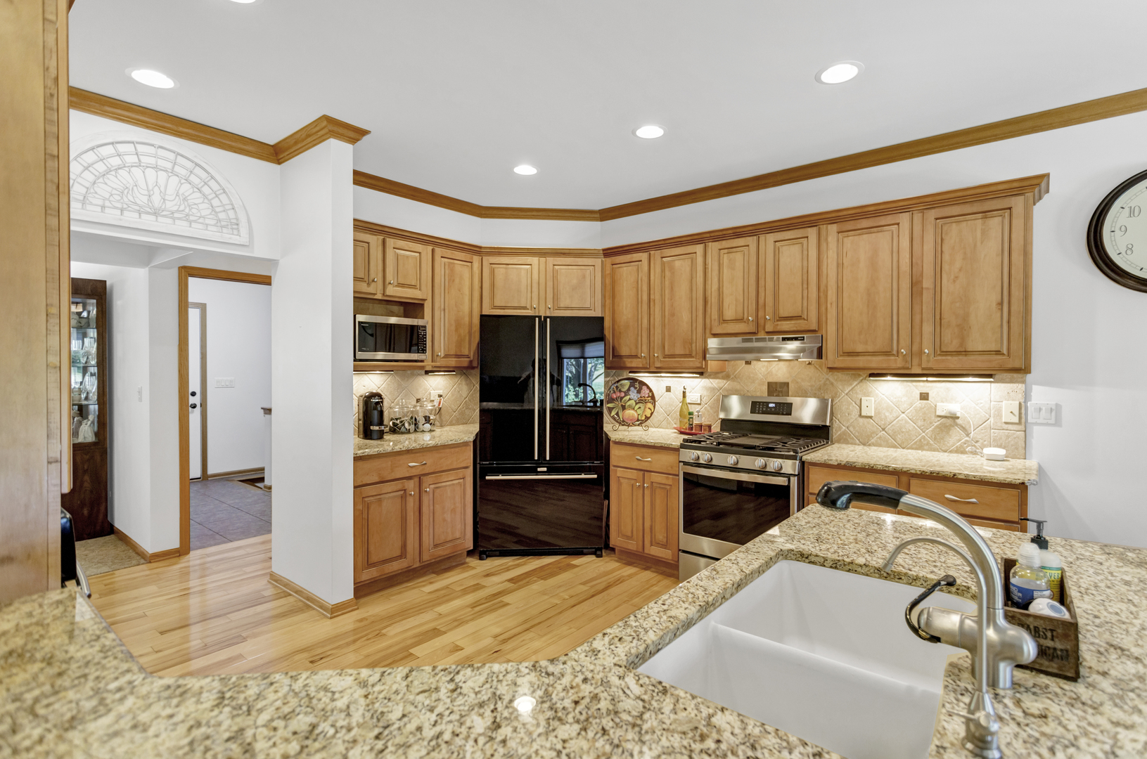 734 Ridge Drive Elburn, IL 60119 - Photo 23 of 48 a kitchen with granite countertop stainless steel appliances and wooden cabinets