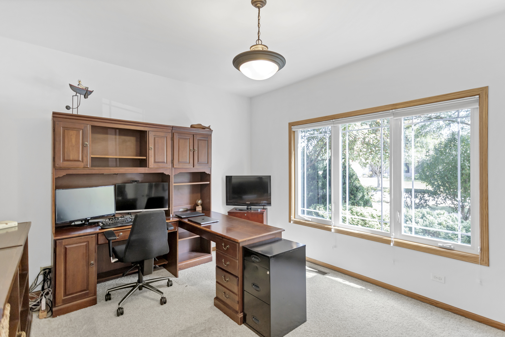 734 Ridge Drive Elburn, IL 60119 - Photo 24 of 48 a view of a workspace with furniture and a window