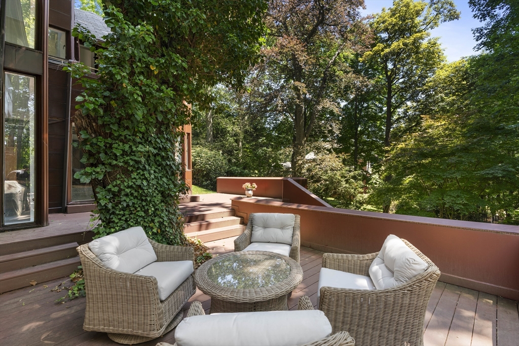 331 Heath Street Brookline, MA 02467 - Photo 13 of 31 a backyard of a house with table and chairs