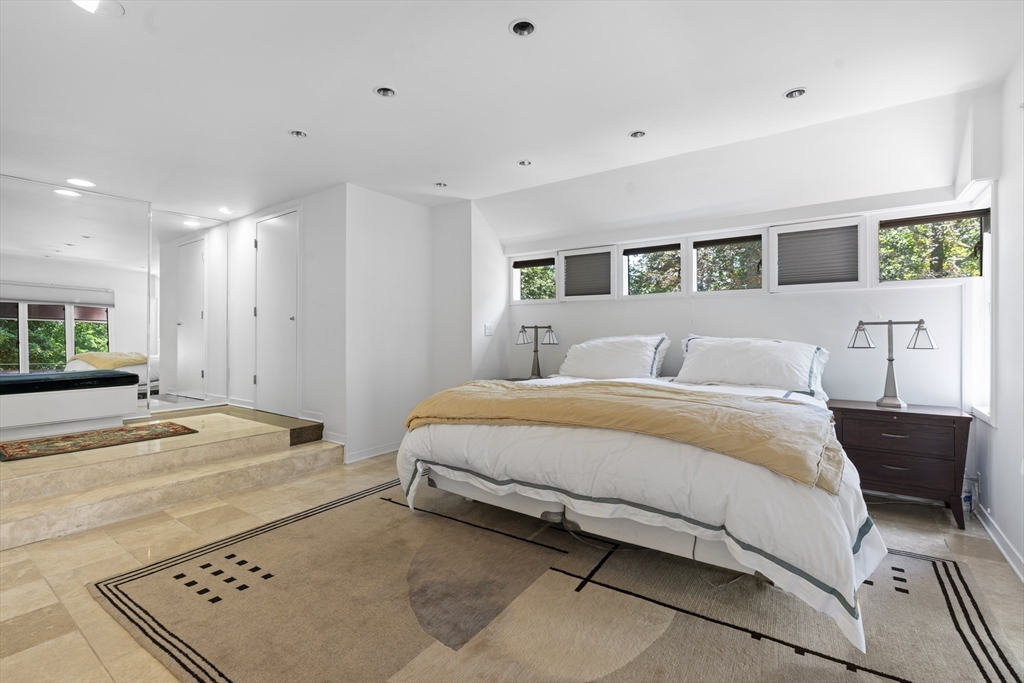 331 Heath Street Brookline, MA 02467 - Photo 15 of 31 a spacious bedroom with a bed and a window