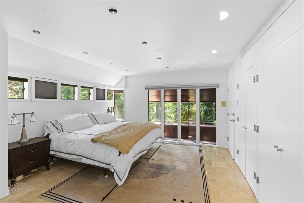 331 Heath Street Brookline, MA 02467 - Photo 17 of 31 a bed room with a bed and a couch